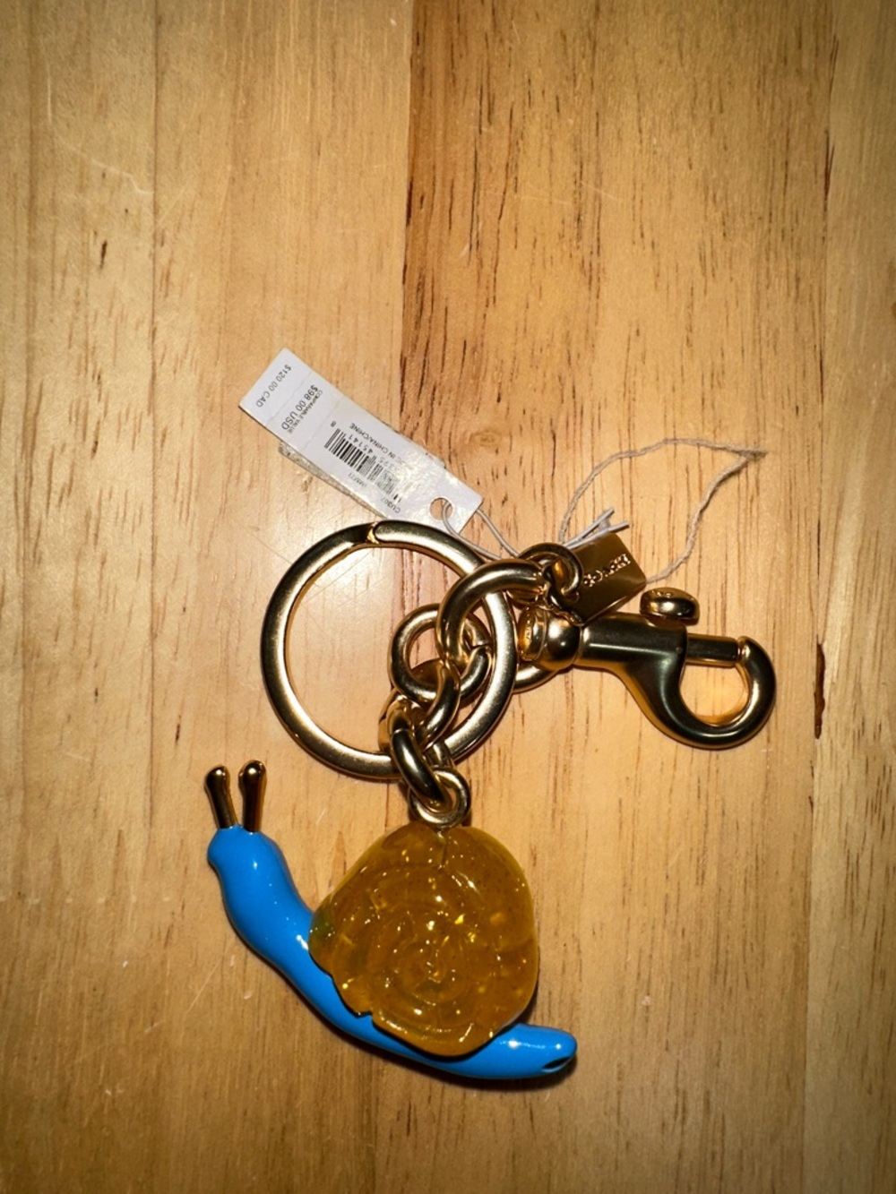 Coach Gold-Tone Keychain with Blue Snail and Amber Charm